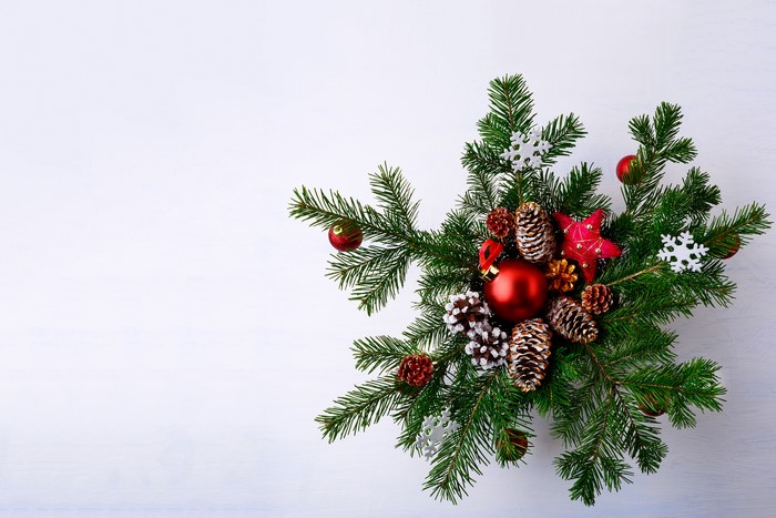 Christmas fir branches with ornaments and pine cones