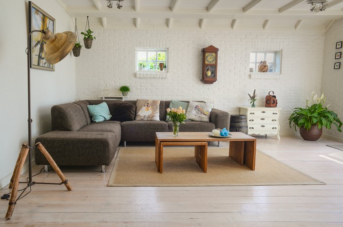 Living room with sectional sofa, coffee table, and floor lamp