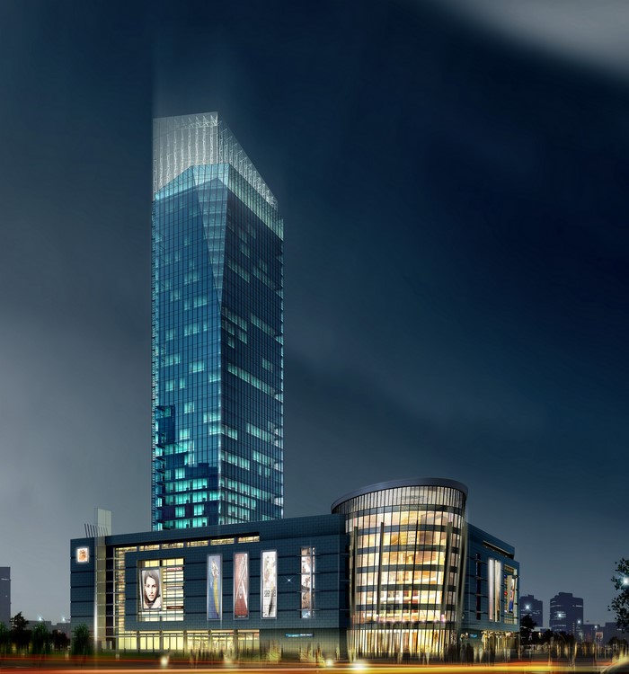Modern skyscraper and commercial building at night