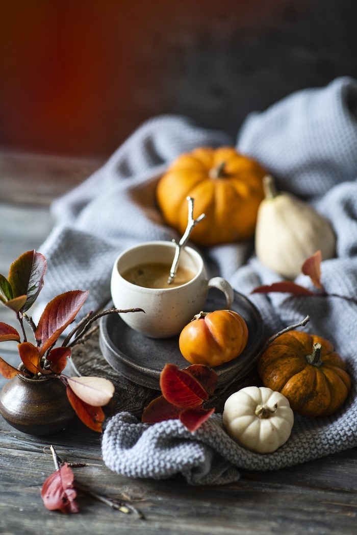 Autumn still life with pumpkins and coffee