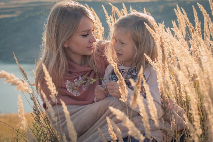 Mother and daughter in tall grass