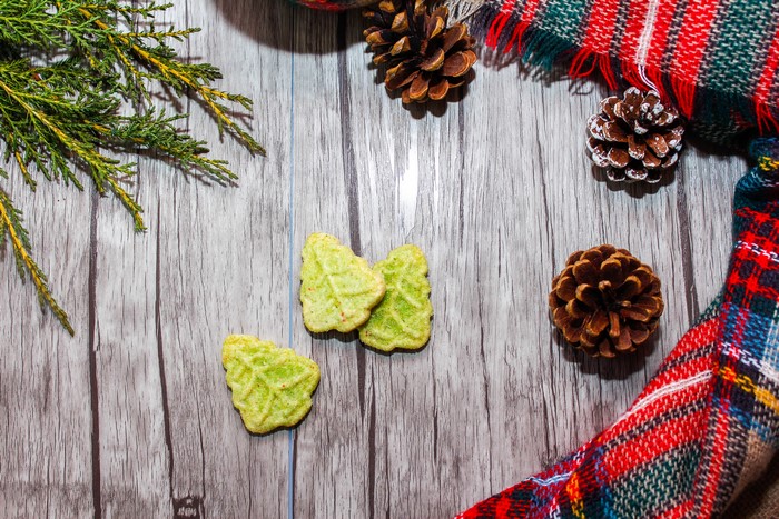 Christmas cookies with pine cones and evergreen branches