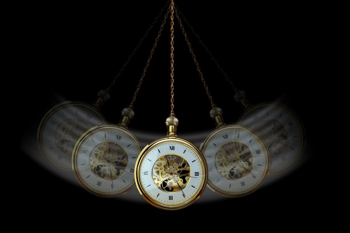 Hypnosis pocket watch swinging on a chain