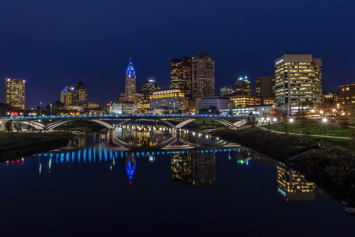 Columbus, Ohio skyline at night with river reflection