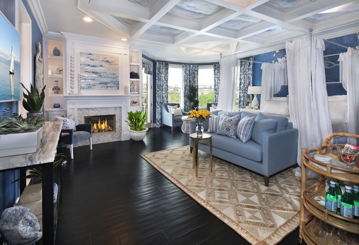 Living room with sofa, carpet, and fireplace
