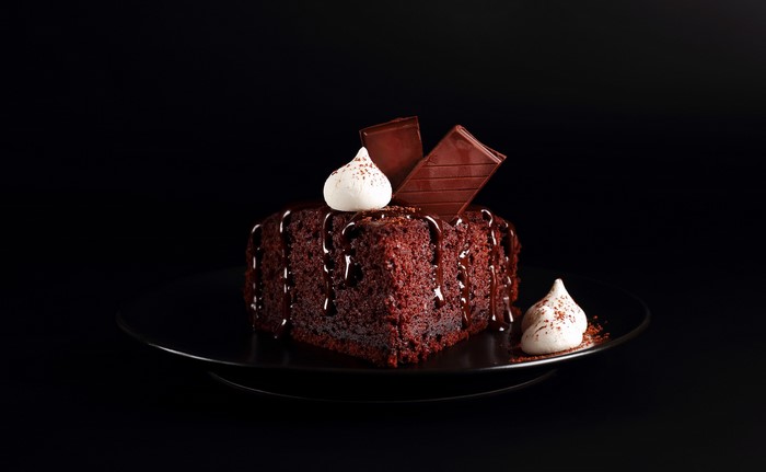 Chocolate cake with chocolate drizzle and meringue