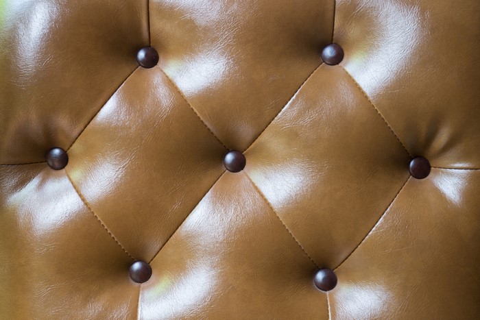 Brown leather tufted upholstery texture