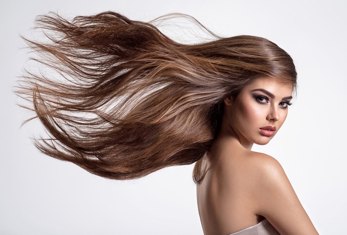 Brown haired woman with hair blowing