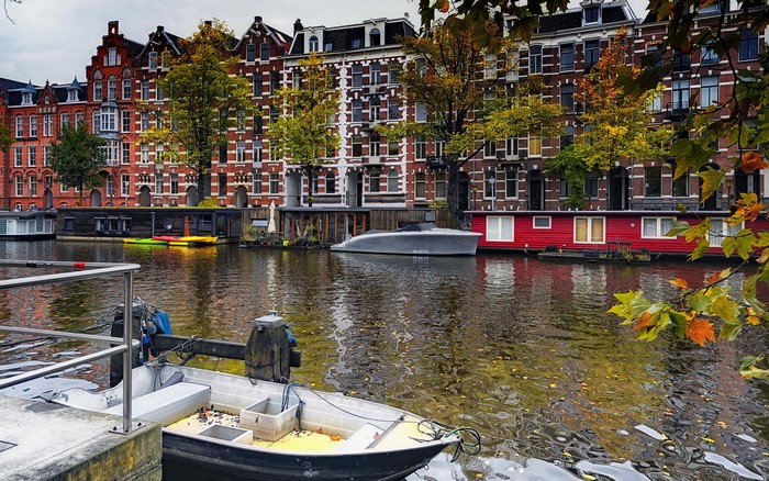 Amsterdam Canal with Houseboats and Buildings