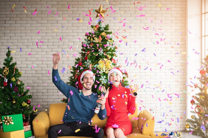 Couple Celebrating Christmas with Confetti