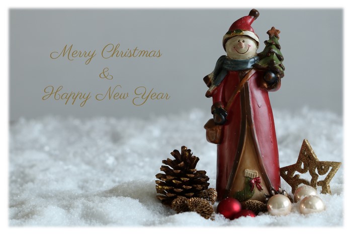 Christmas and New Year greeting with snowman figurine