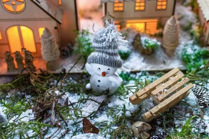 Christmas scene with snowman and sled