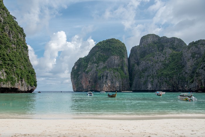 Maya Bay, Ko Phi Phi Le, Thailand with boats and limestone cliffs