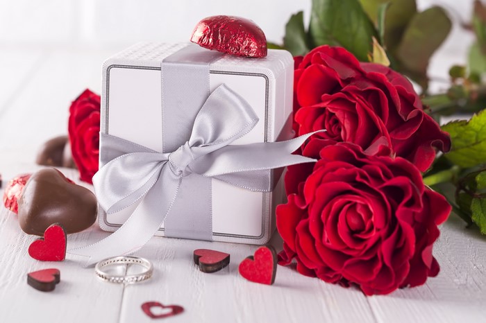 Valentine's Day gift with roses, chocolates, and ring