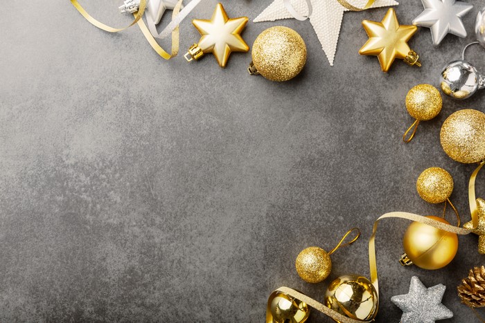 Christmas ornaments and ribbons on a gray background