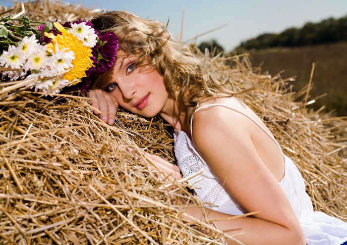 Woman with Flowers on Straw
