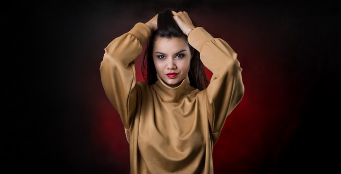 Woman with hands in hair