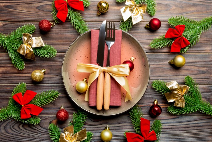 Christmas Table Setting with Pine Branches and Ornaments