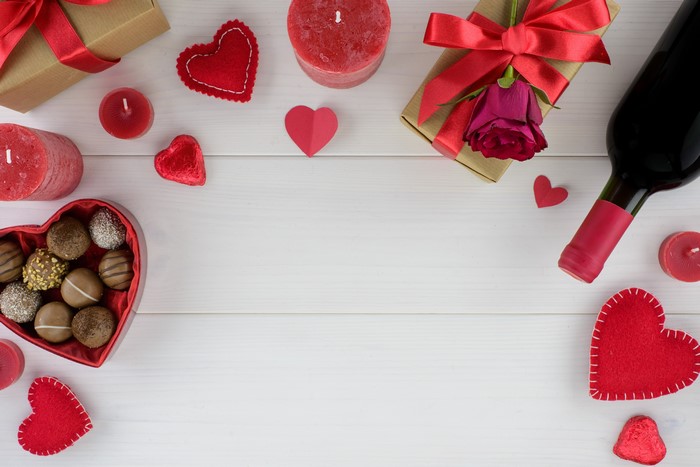 Valentine's Day gifts, wine, candles, and chocolates