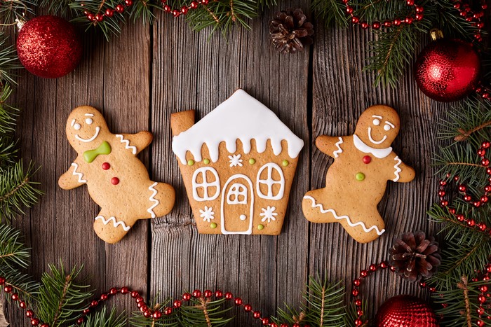 Christmas gingerbread cookies and decorations on wood