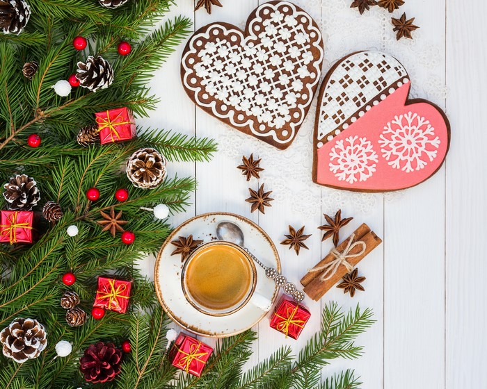 Christmas cookies and coffee with pine branches