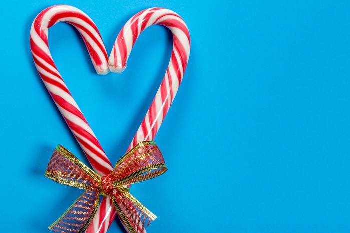 Candy canes tied with a bow in a heart shape