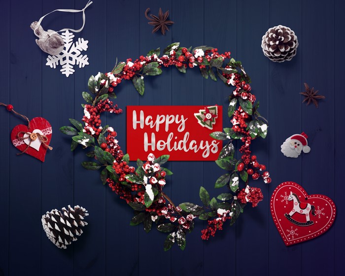 Christmas wreath with "Happy Holidays" card and ornaments