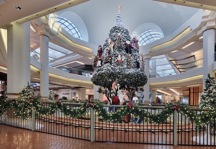 Christmas tree with Santa Claus and fairy lights in a mall