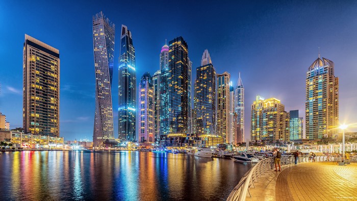 Dubai Marina skyscrapers at night with waterfront