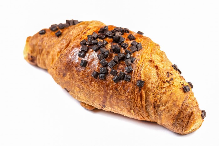 Chocolate Croissant with Chocolate Chips on White Background