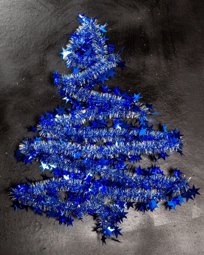Blue tinsel Christmas tree with stars