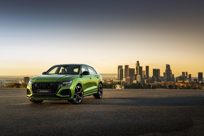 Green Audi RS Q8 Crossover at Sunset in City