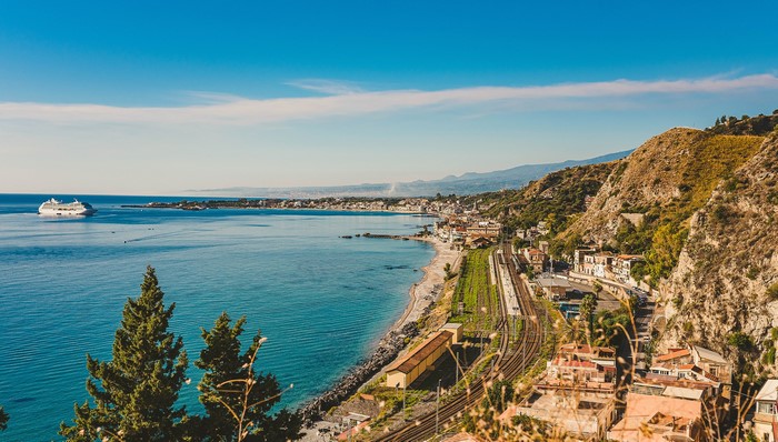 Taormina, Sicily: Coastal Town with Cruise Ship and Train Tracks