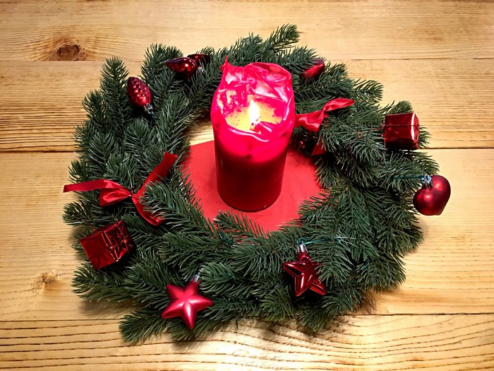 Christmas wreath with red candle and ornaments
