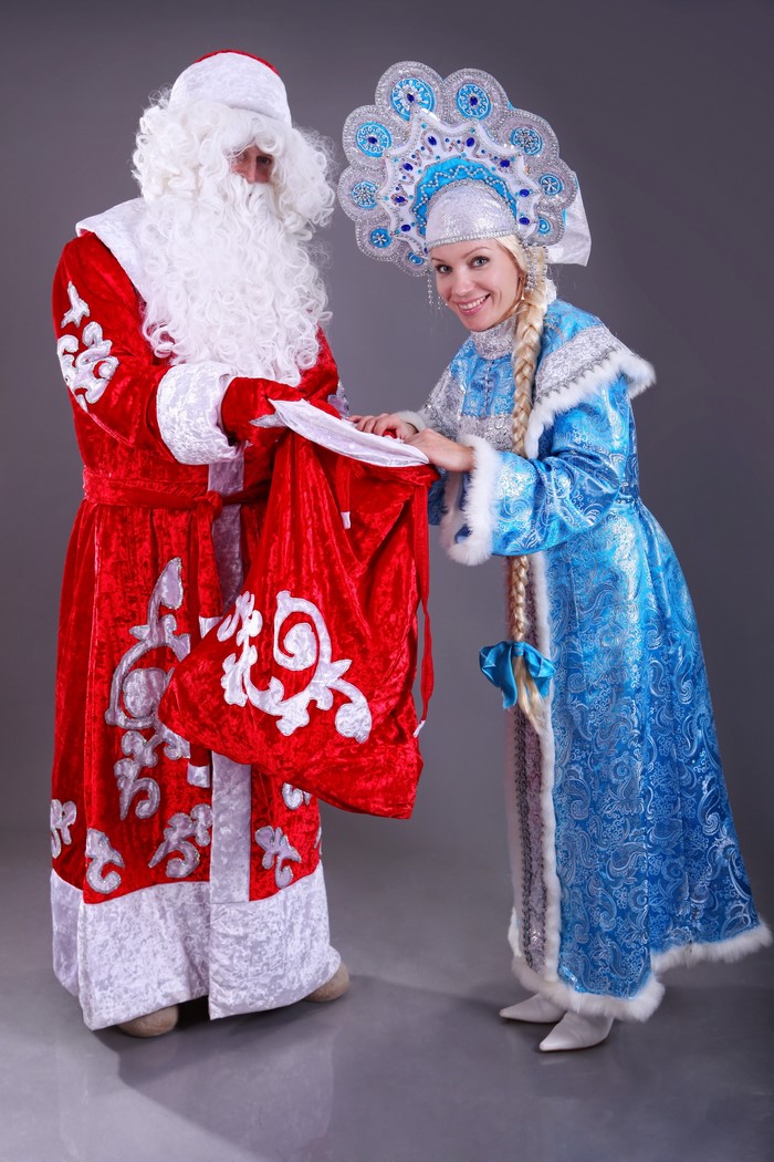 Santa Claus and Snow Maiden with a Gift Bag