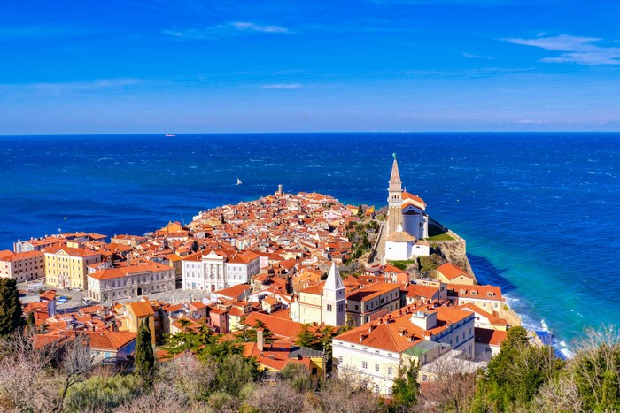 Piran, Slovenia coastal town with red roofs and blue sea