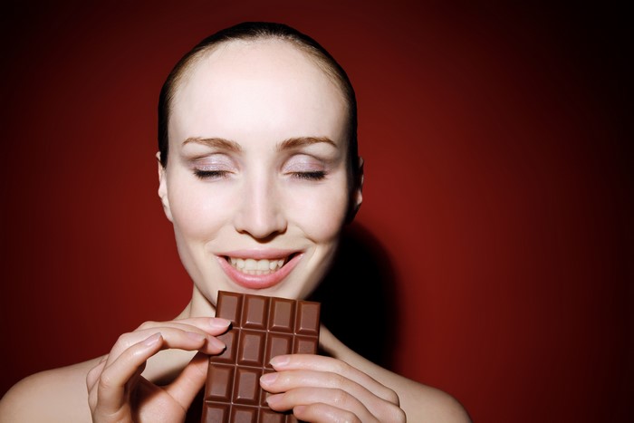 Woman with chocolate bar