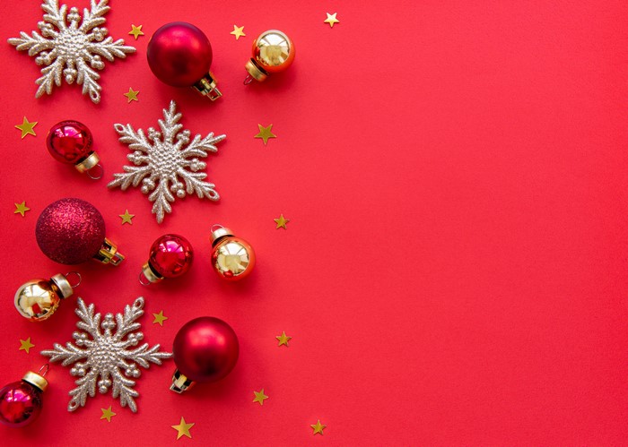 Christmas ornaments and snowflakes on red background