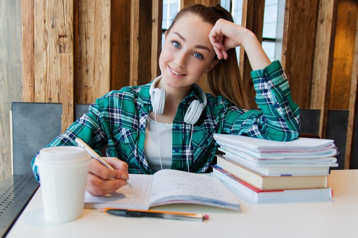 Female student with headphones studying