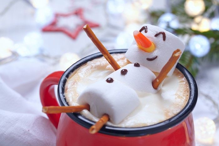 Marshmallow snowmen in a mug of hot chocolate