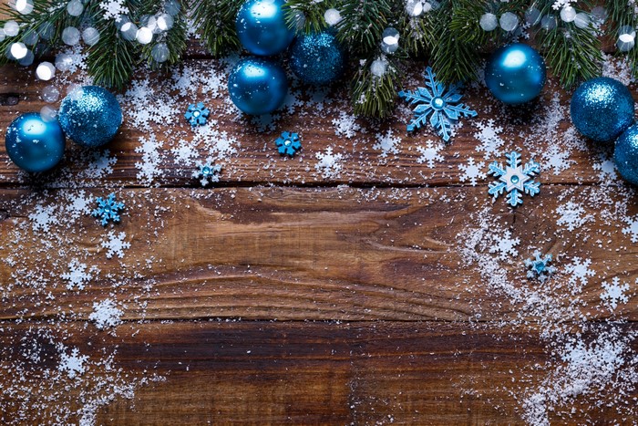 Christmas ornaments and snowflakes on wood