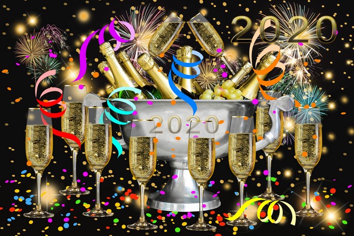 Champagne celebration for 2020 with fireworks and confetti