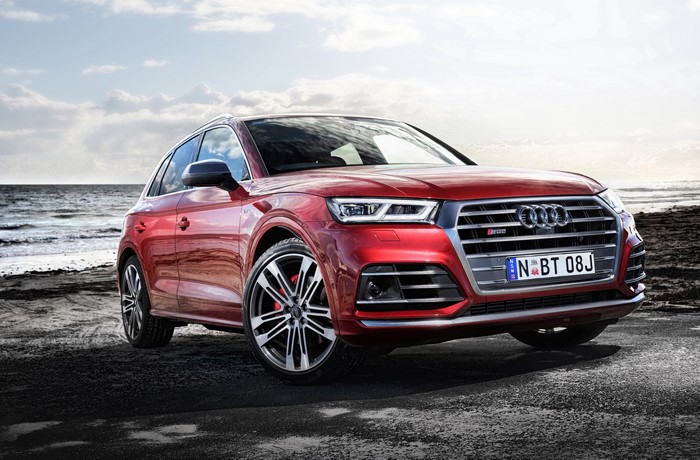 Red 2017 Audi Q5 S line on a beach
