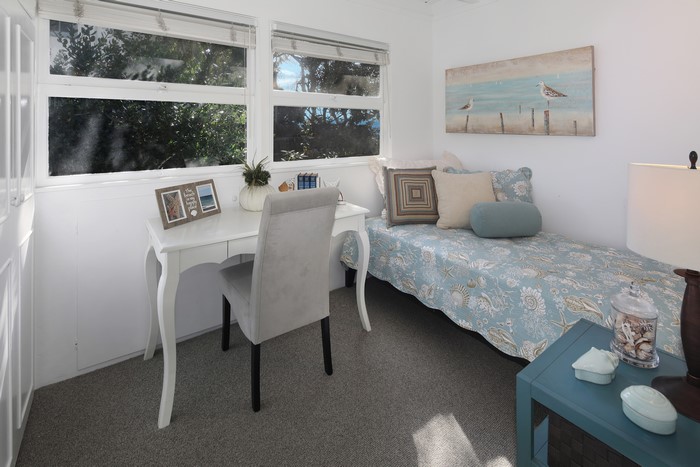 Bedroom with a desk and a daybed