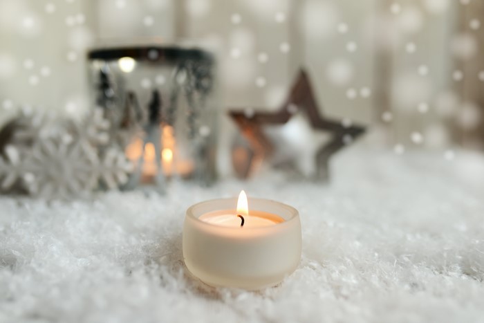 Candle with snowflakes and star decoration