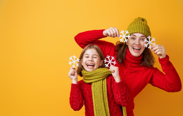 Mother and daughter with snowflakes