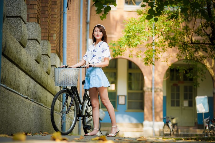 4K Asian Woman with Bicycle in Bokeh Light