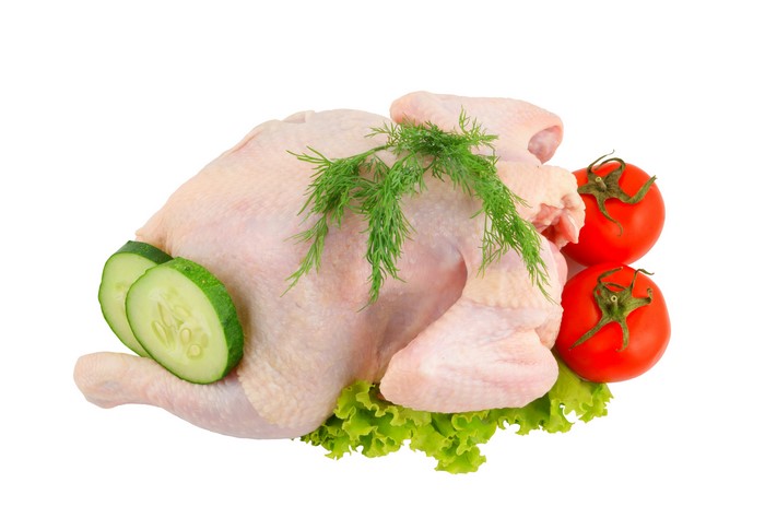 Raw chicken with tomatoes, cucumbers, dill, and lettuce