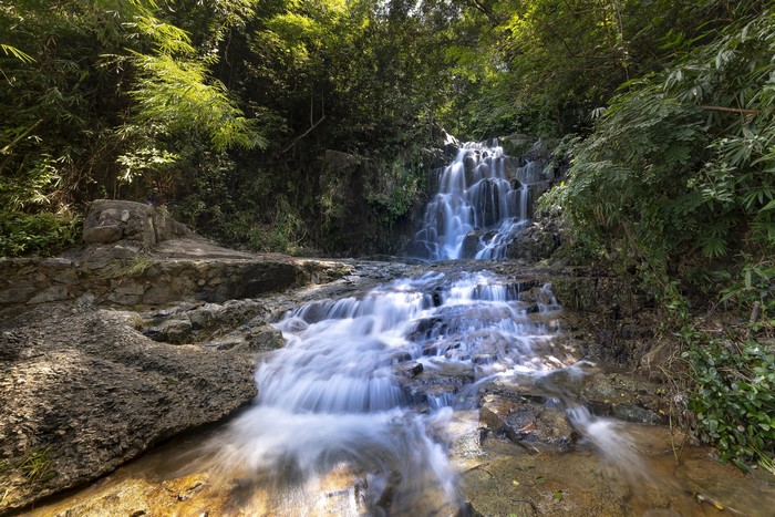 Waterfall flowing over rocks in a forest