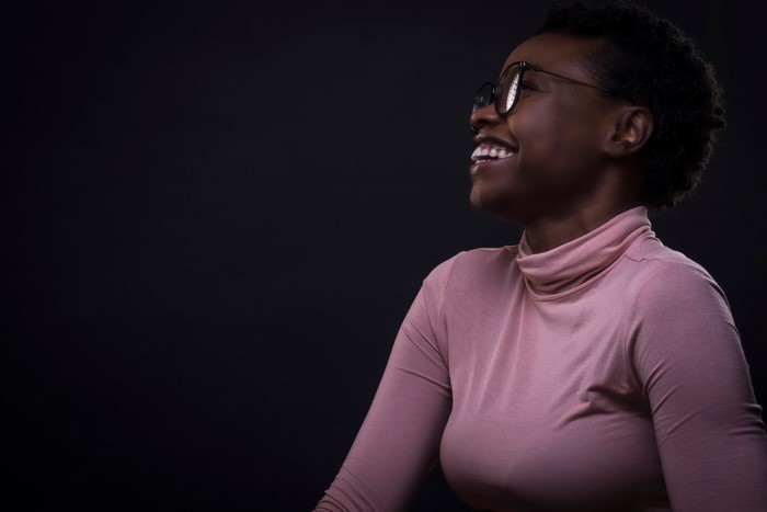 Woman with glasses laughing